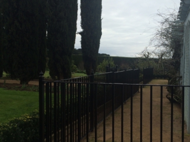 Black wrought iron pool fence