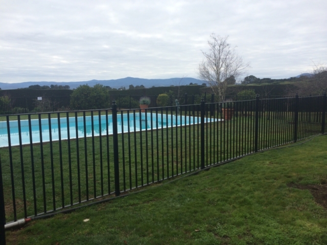 Black wrought iron pool fence