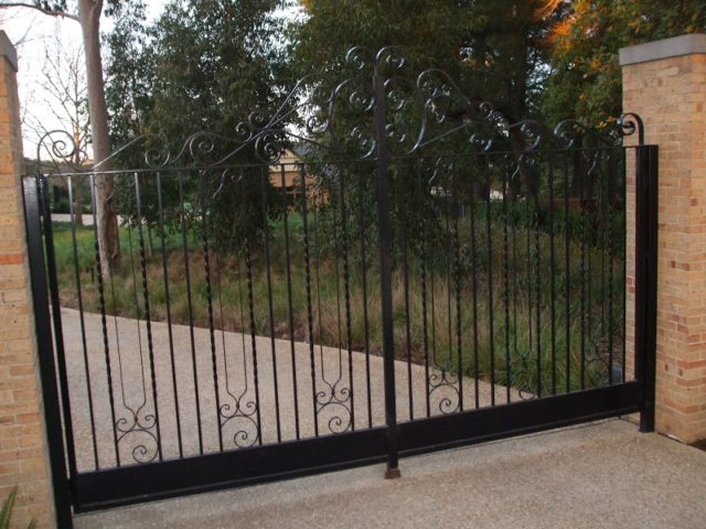 Black wrought iron swing gates