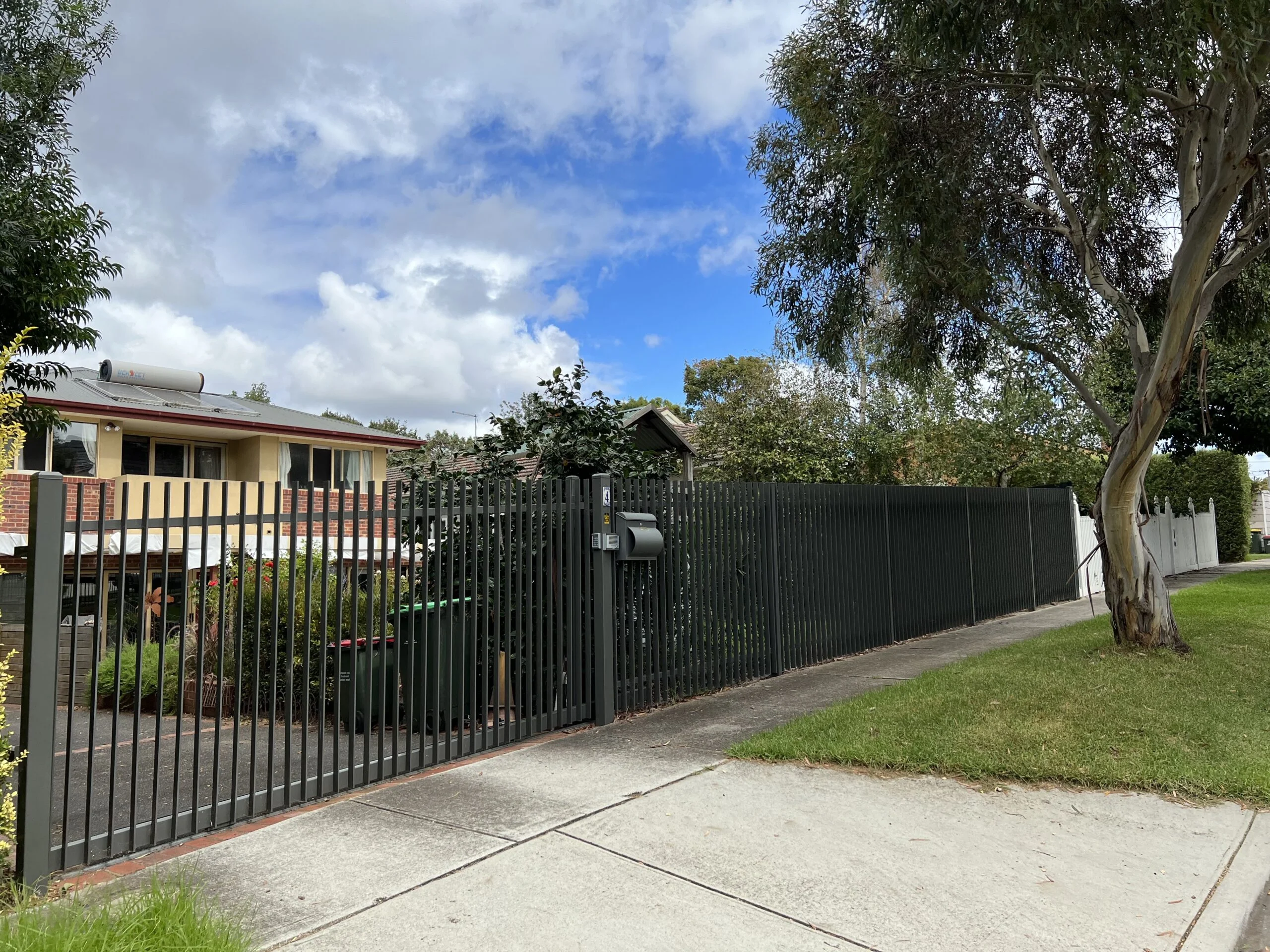 steel-blade-fence-sliding-gate